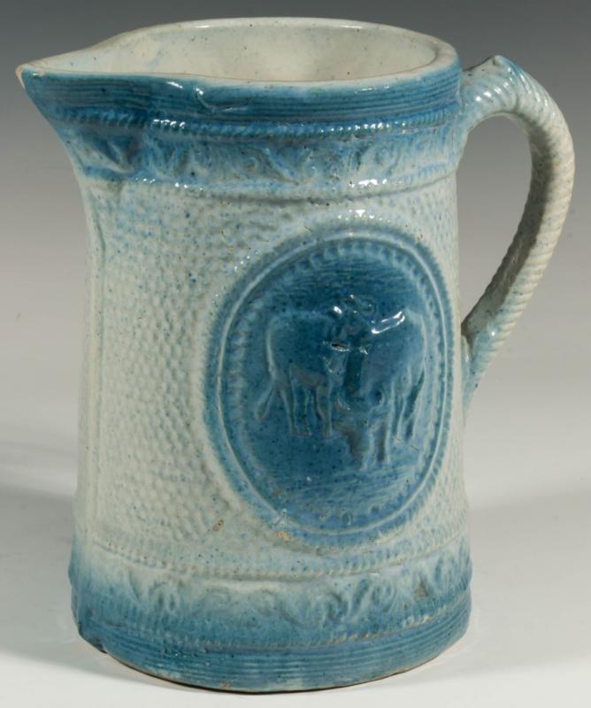 AN ANTIQUE BLUE AND WHITE STONEWARE PITCHER
