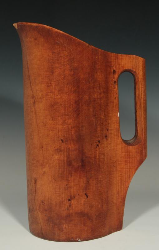 A COUNTRY PRIMITIVE ONE-PIECE WOOD PITCHER 