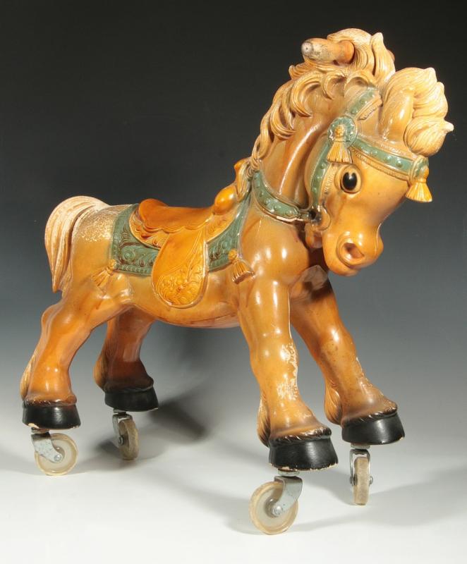 A VINTAGE PLASTIC HORSE RIDE-ON TOY