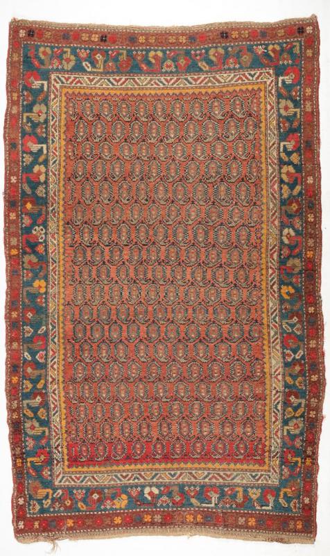 AN ANTIQUE PERSIAN HAMADAN RUG WITH BOTEH FIELD