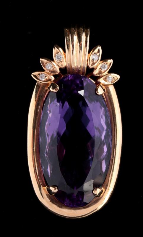 A FACETED AMETHYST PENDANT IN 14K GOLD
