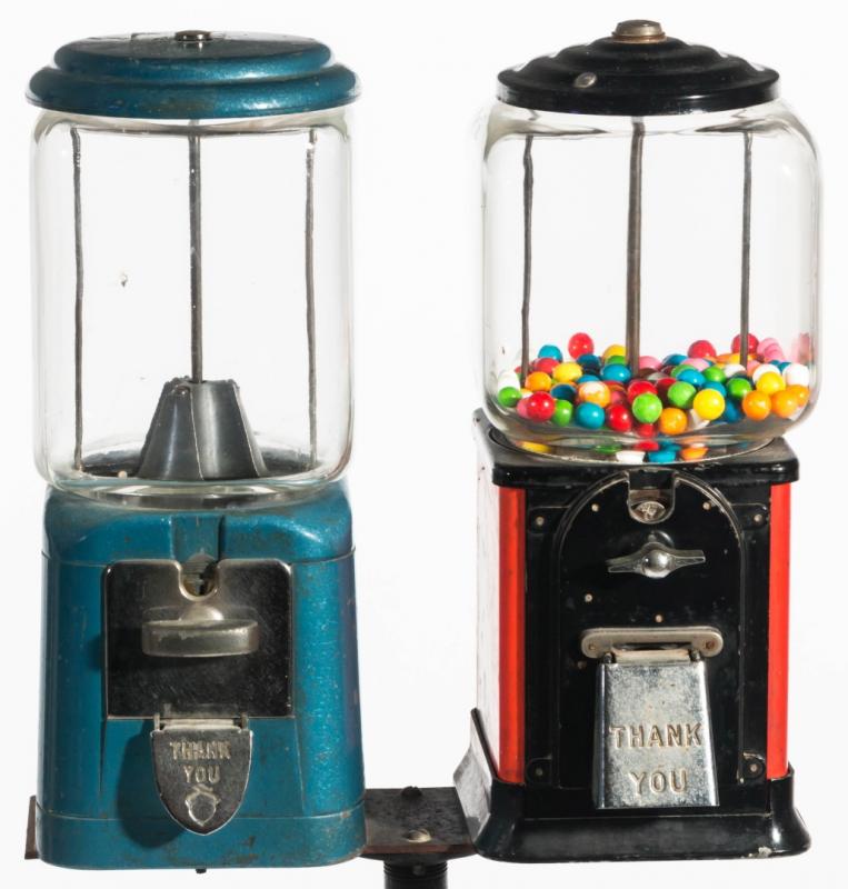 VINTAGE COIN OPERATED GUMBALL MACHINES ON STAND