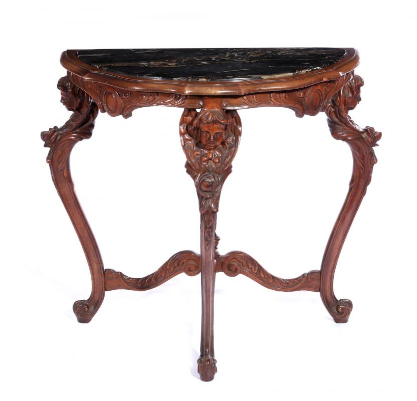 AN EARLY 20C. ITALIAN WALNUT TABLE WITH CHERUBS