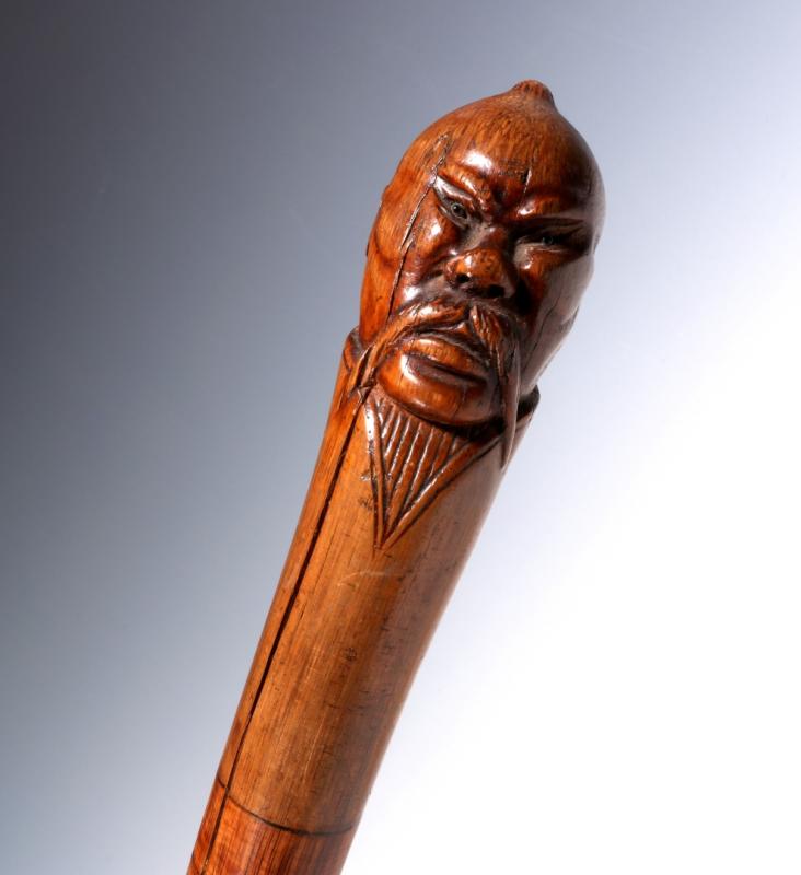 A 19TH C. CARVED MANCHURIAN MALE HEAD WALKING STICK 