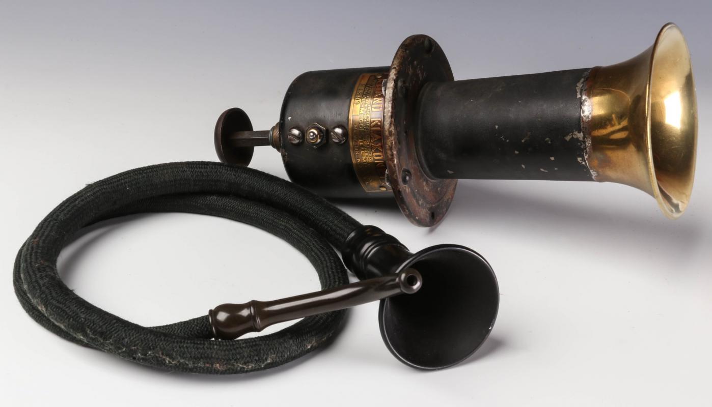 A 1915 HAND KLAXONET APLUS AN ANTIQUE EAR TRUMPET