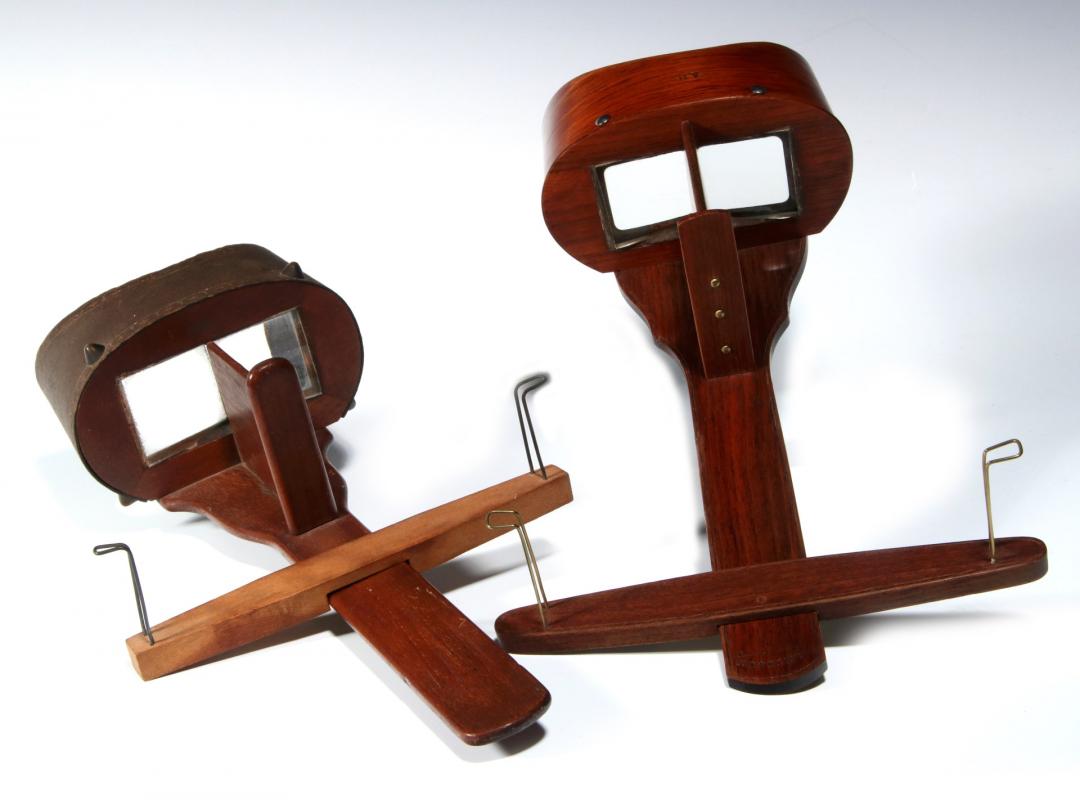 TWO 19TH CENTURY HAND-HELD STEREOSCOPES