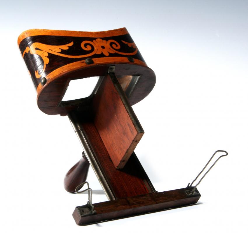 A 19TH CENTURY HAND-HELD STEREOSCOPE