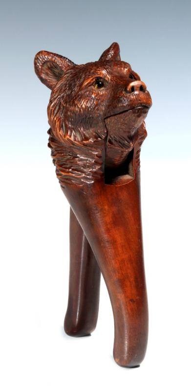 A BLACK FOREST CARVED WOOD FIGURAL BEAR NUTCRACKER