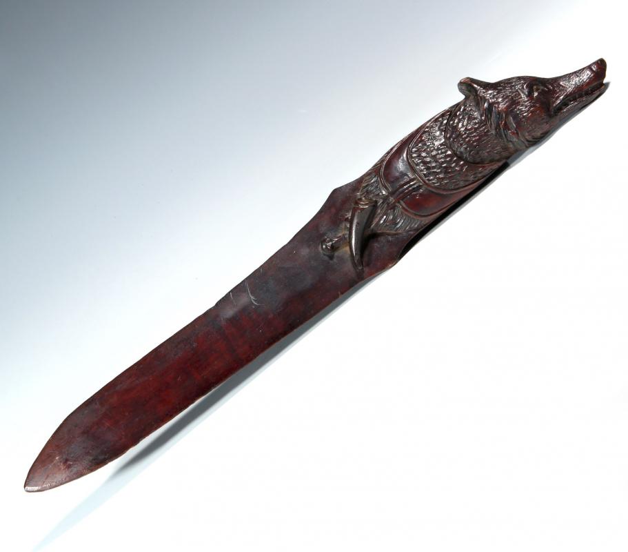 A BLACK FOREST CARVED WOOD WOLF'S HEAD LETTER OPENER