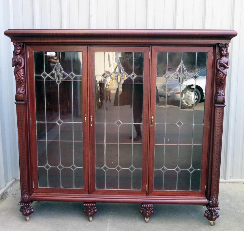 A MAHOGANY WINGED LADY BOOKCASE WITH LEADED GLASS