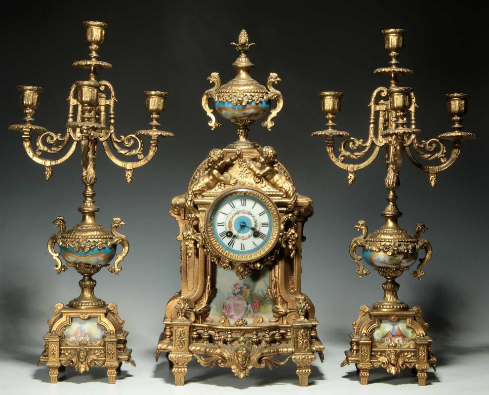 A THREE-PIECE FRENCH SPELTER CLOCK SET 