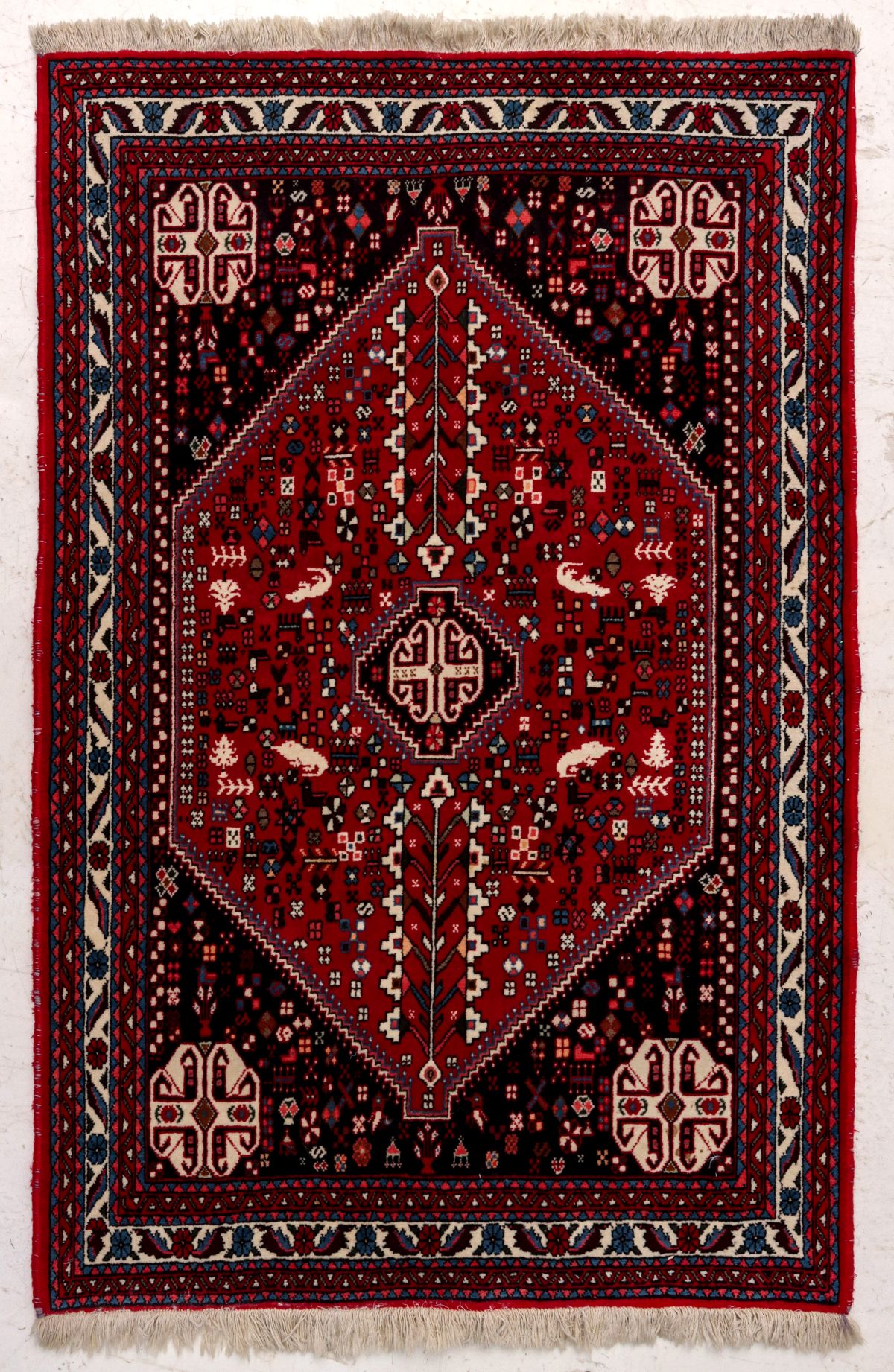 A LATE 20TH CENTURY HAND MADE RUG WITH REPTILE FIGURES