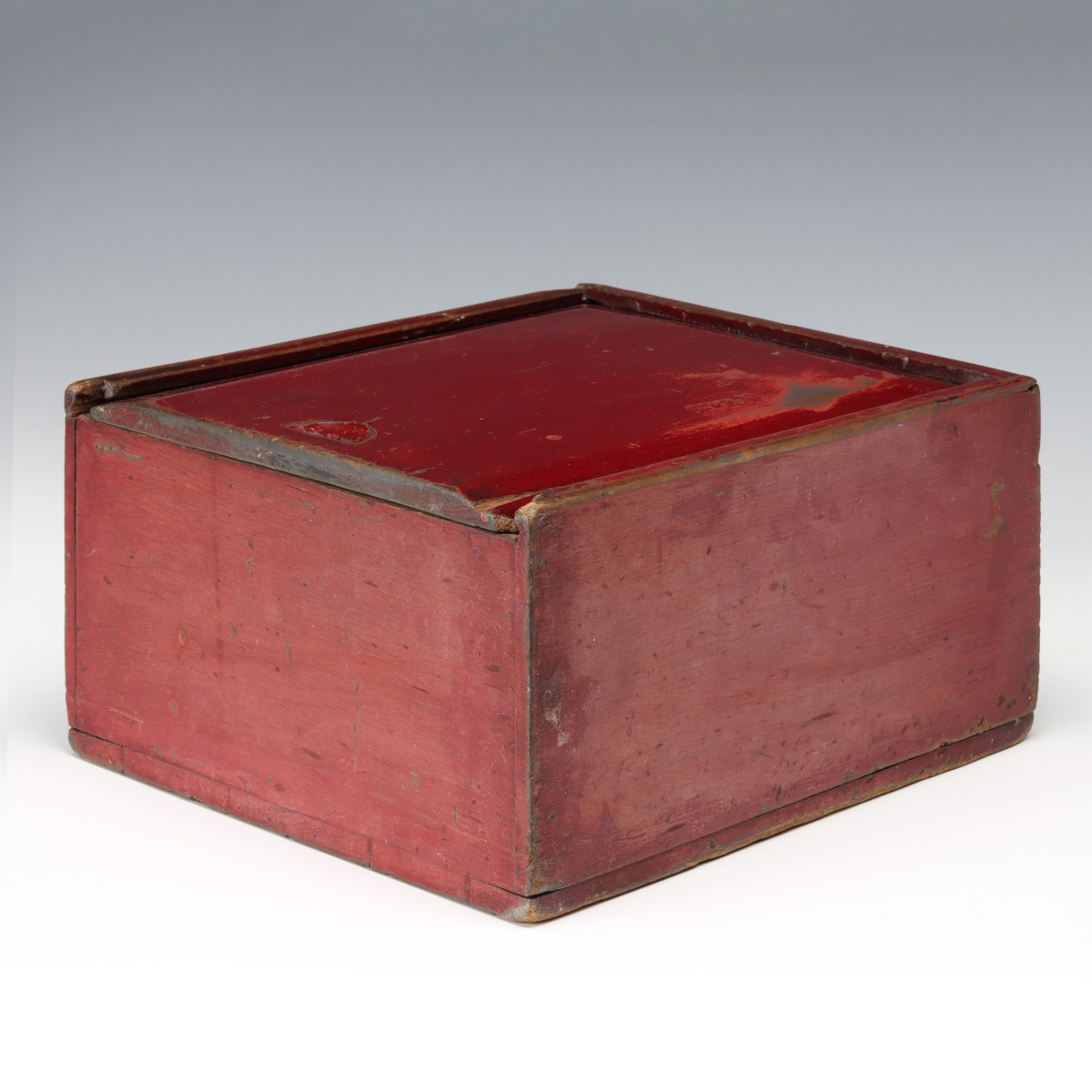 A GOOD 19TH C. SLIDE TOP CANDLE BOX IN OLD RED PAINT