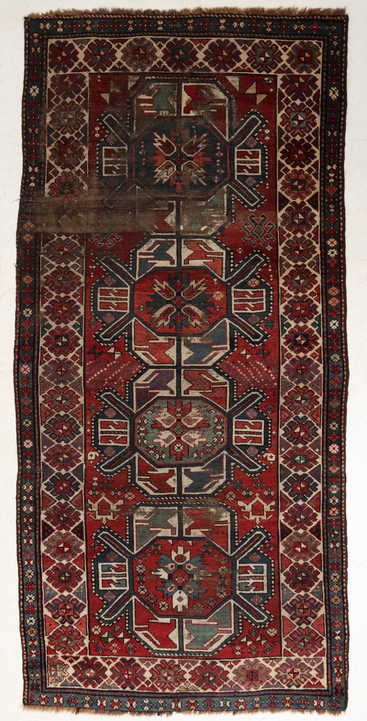 TWO GOOD ANTIQUE CAUCASIAN RUGS WITH HEAVY WEAR