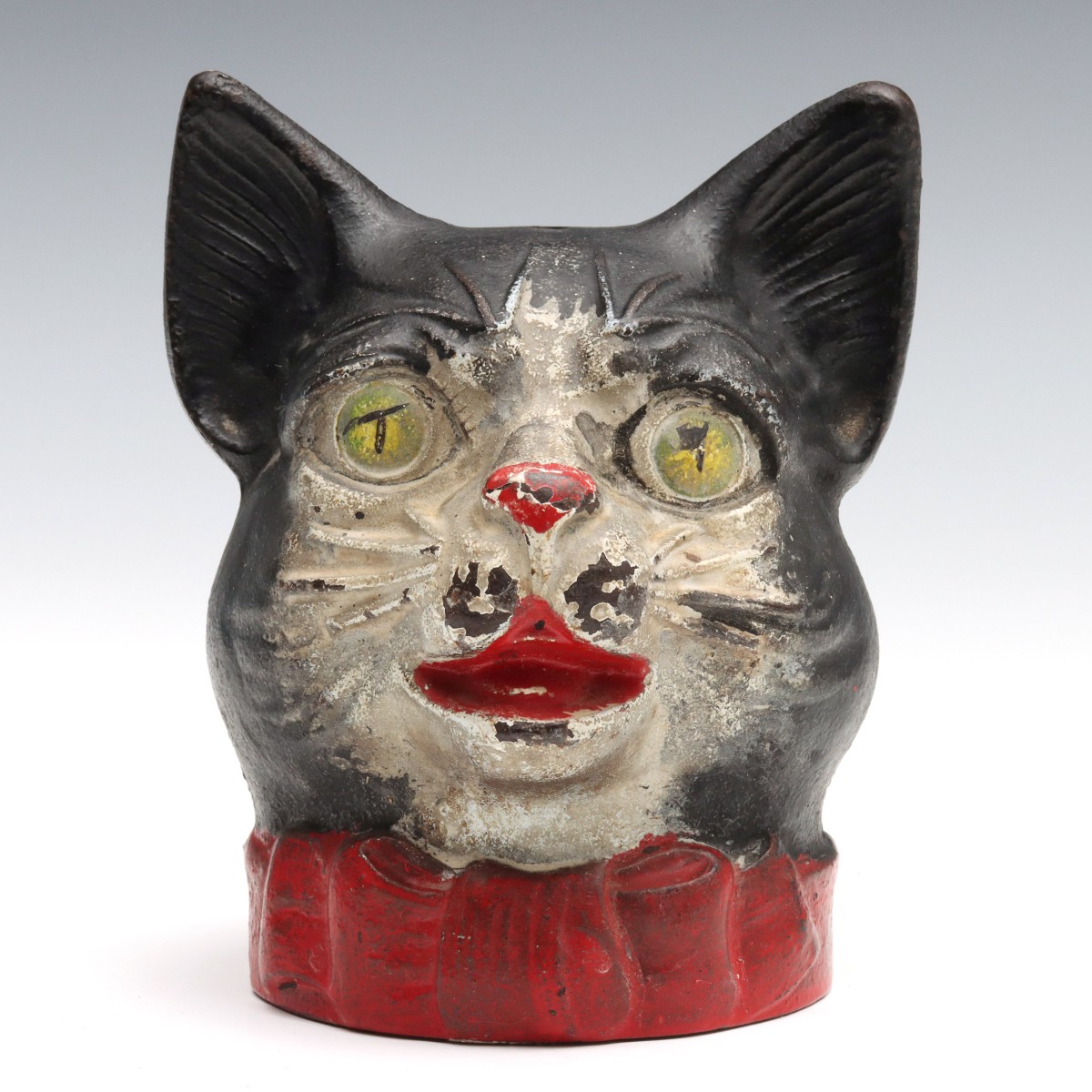 A RARE CAST IRON CAT HEAD STRING HOLDER CIRCA 1920s
