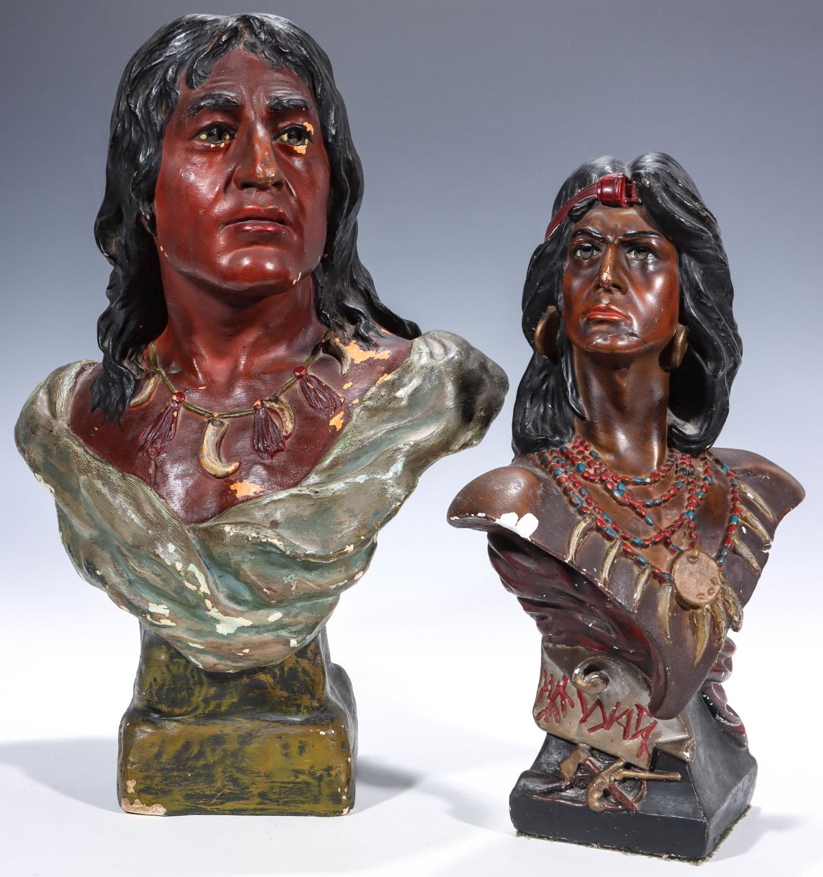 TWO EARLY 20C. POLYCHROME ENAMEL PLASTER INDIAN BUSTS