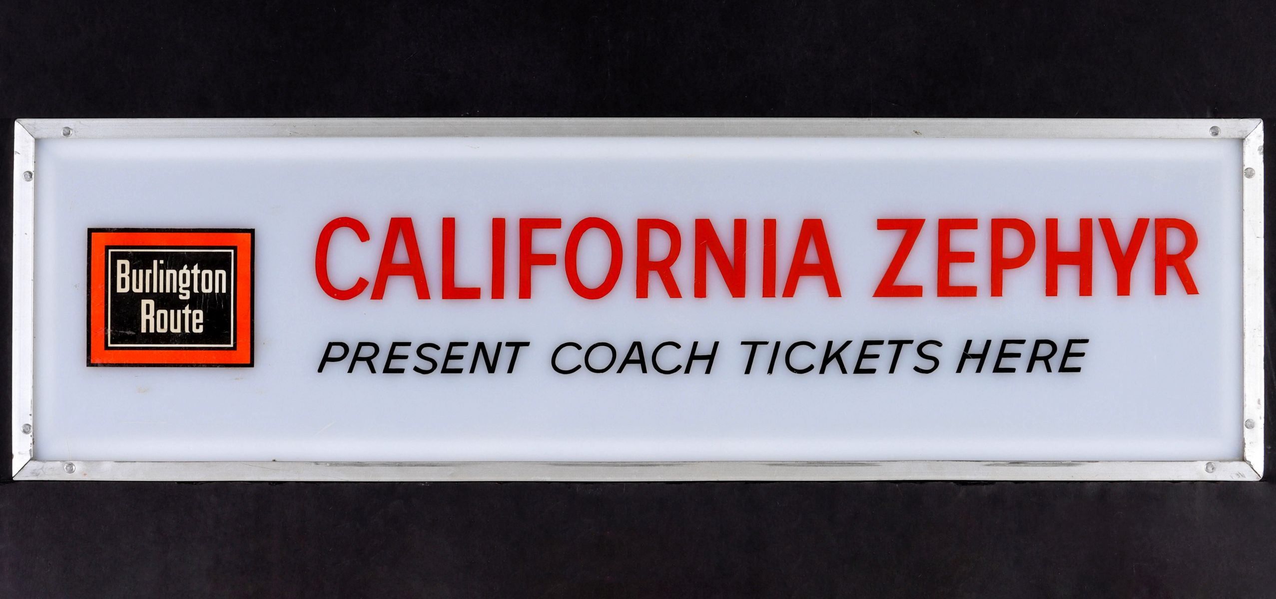 AN ACRYLIC CALIFORNIA ZEPHYR STATION TICKETS SIGN