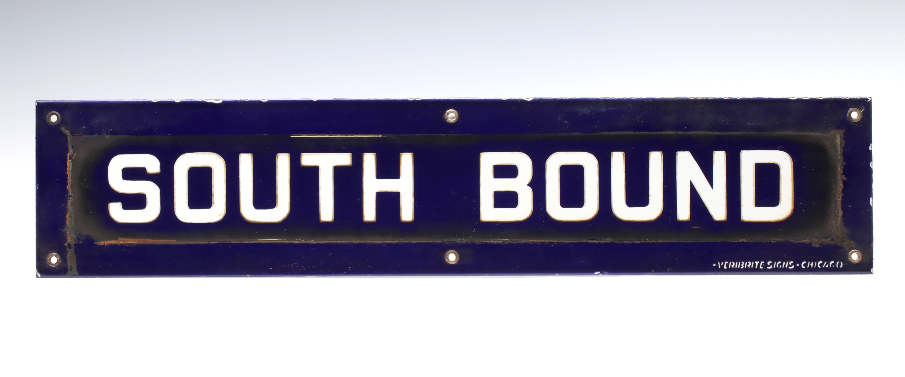 A PORCELAIN ENAMEL SIGN LETTERED ''SOUTH BOUND''
