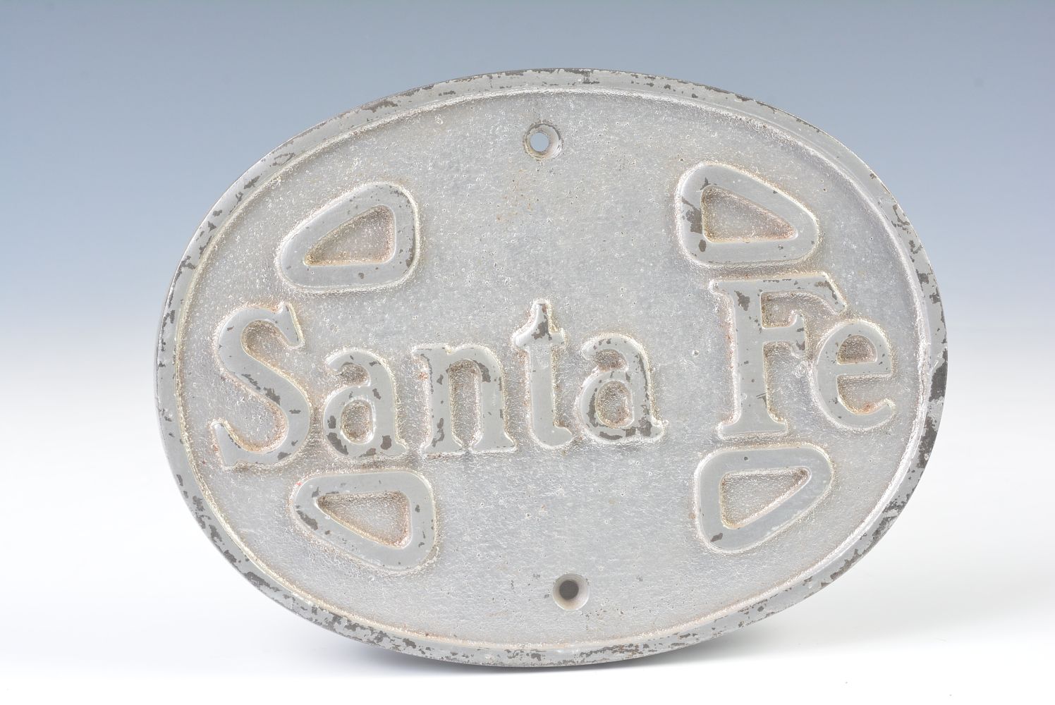 AN EARLY 20TH C. OVAL IRON PLAQUE LETTERED SANTA FE