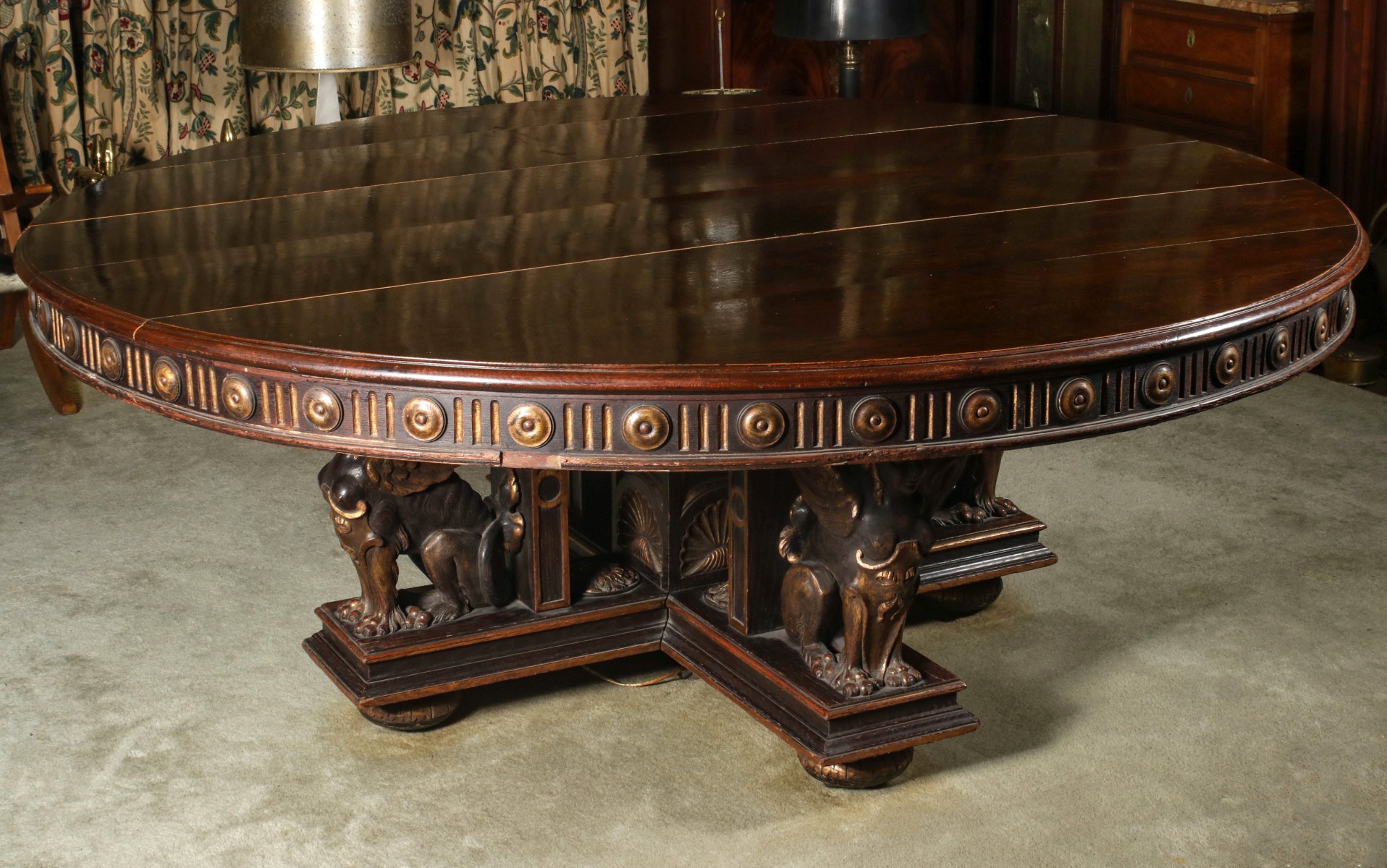 A MASSIVE CARVED OAK DINING TABLE WITH FEMALE SPHINX