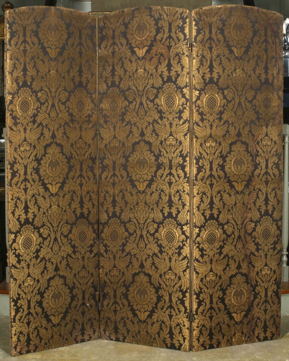 A THREE FOLD DAMASK COVERED FLOOR SCREEN