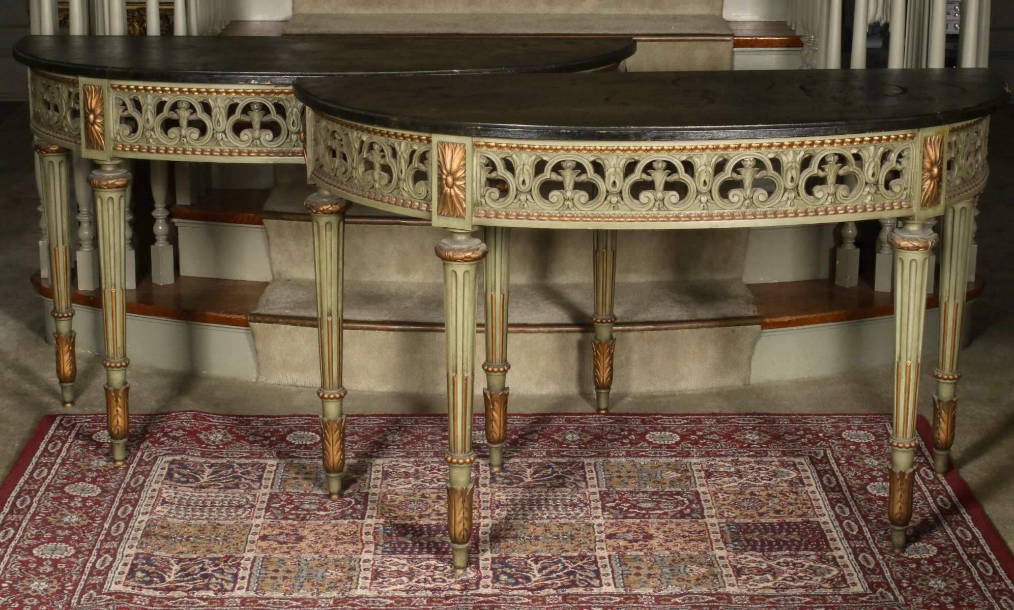A PAIR OF EARLY 20TH C. PAINTED DEMILUNE CONSOLES