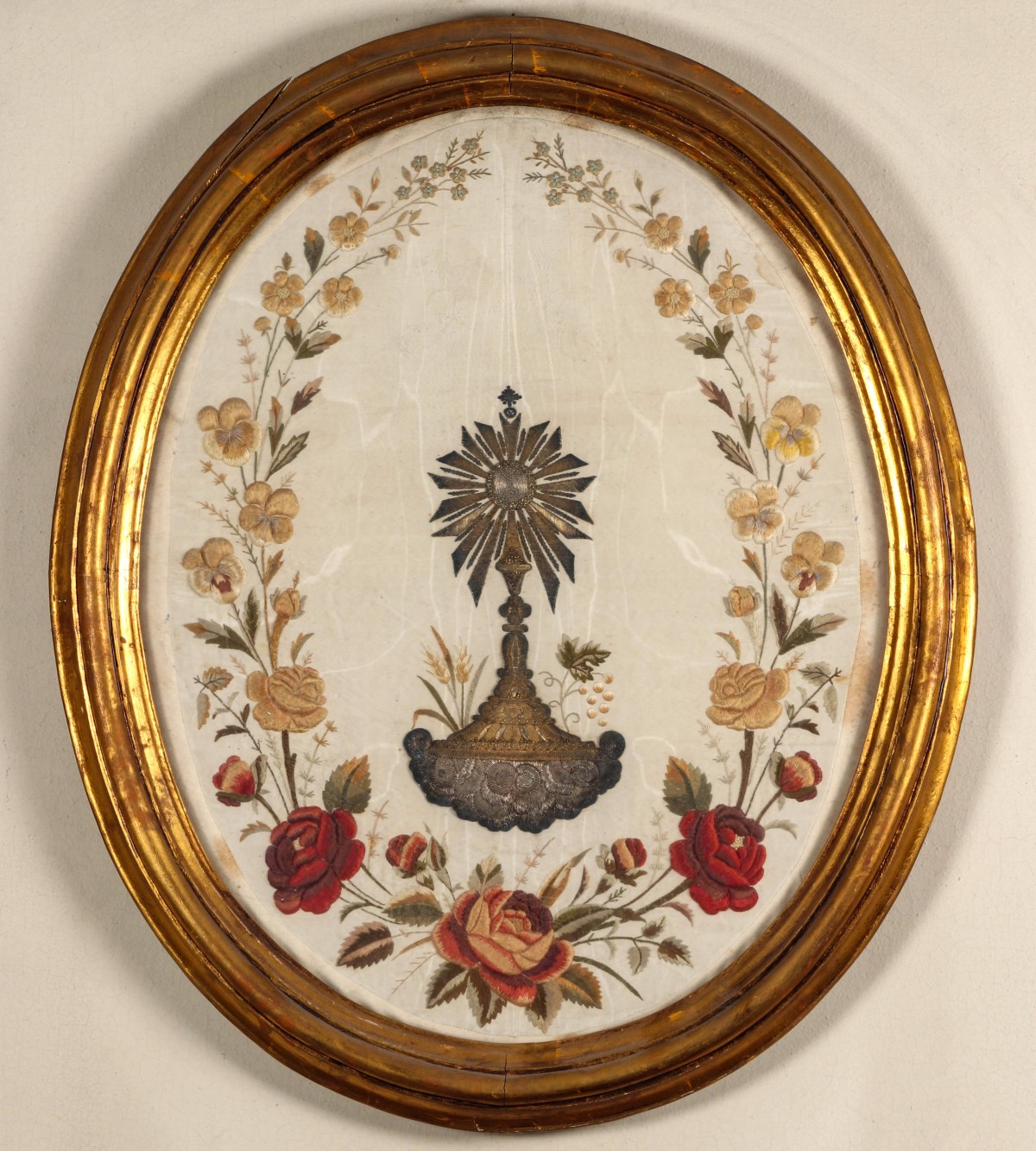 AN 18TH/19TH C. EMBROIDERED PANEL WITH MONSTRANCE