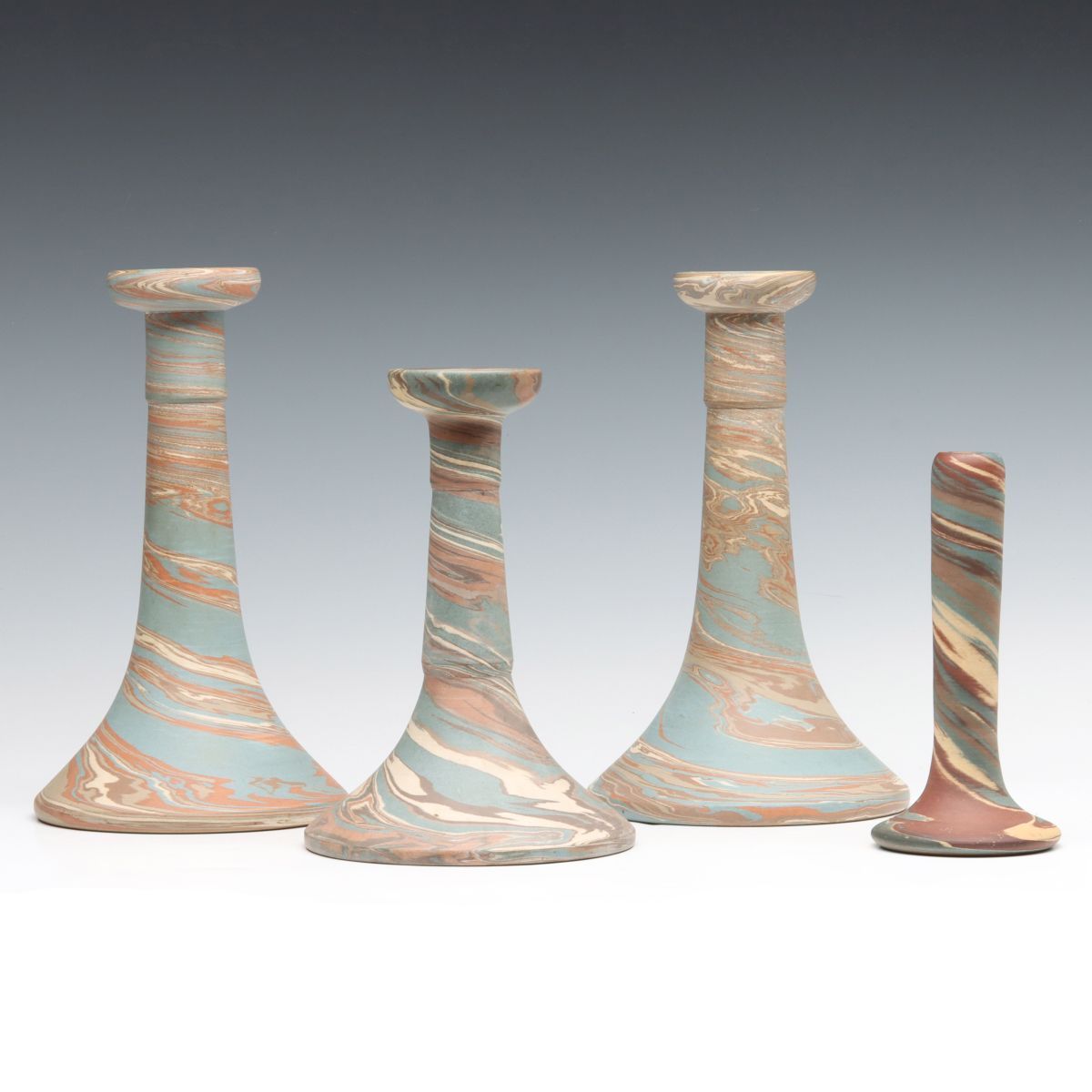 A COLLECTION OF NILOAK MISSIONWARE CANDLESTICKS