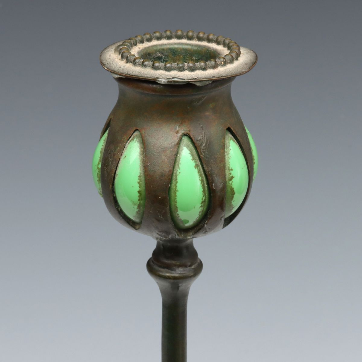 A TIFFANY STUDIOS BRONZE AND BLOWN GLASS CANDLESTICK