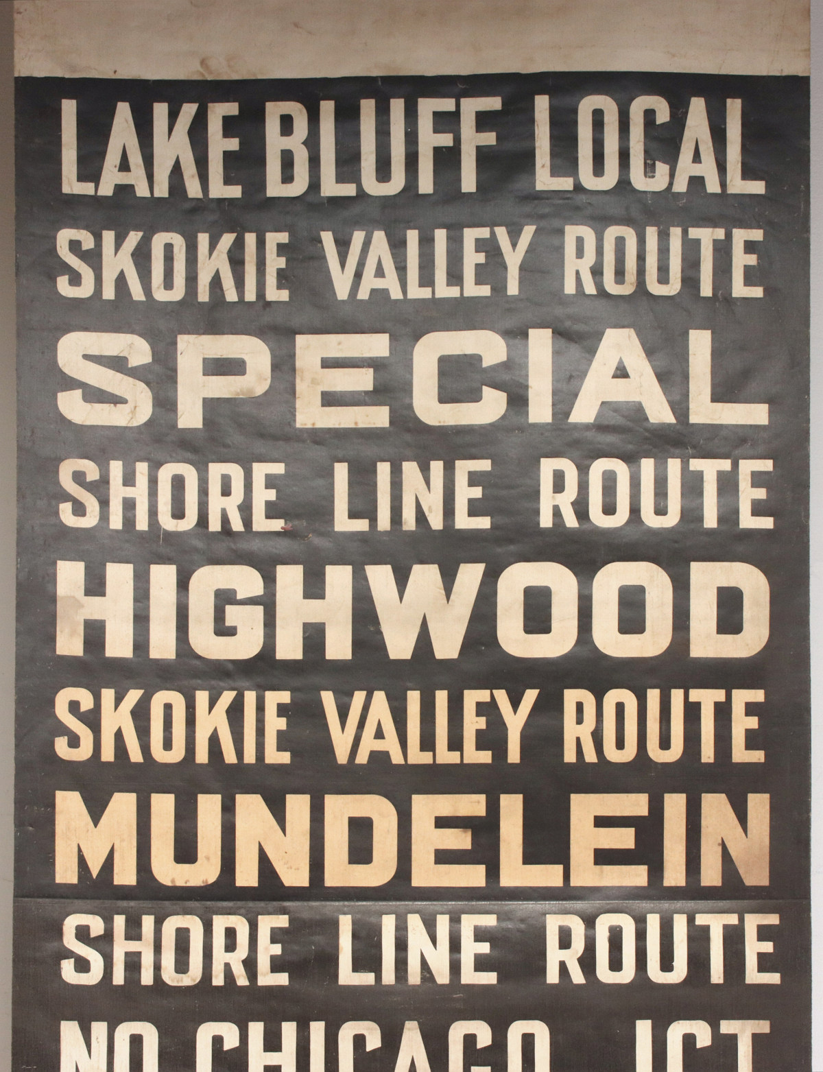 A PRINTED CANVAS GATE SIGN FOR THE CNW SKOKIE LINE RTE