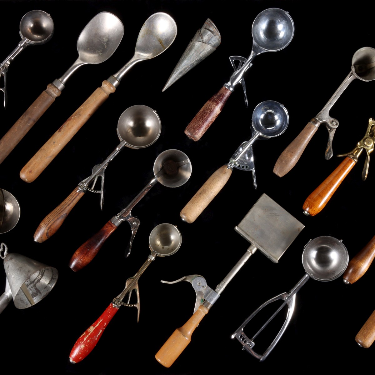 A COLLECTION OF FIFTEEN ANTIQUE ICE CREAM SCOOPS
