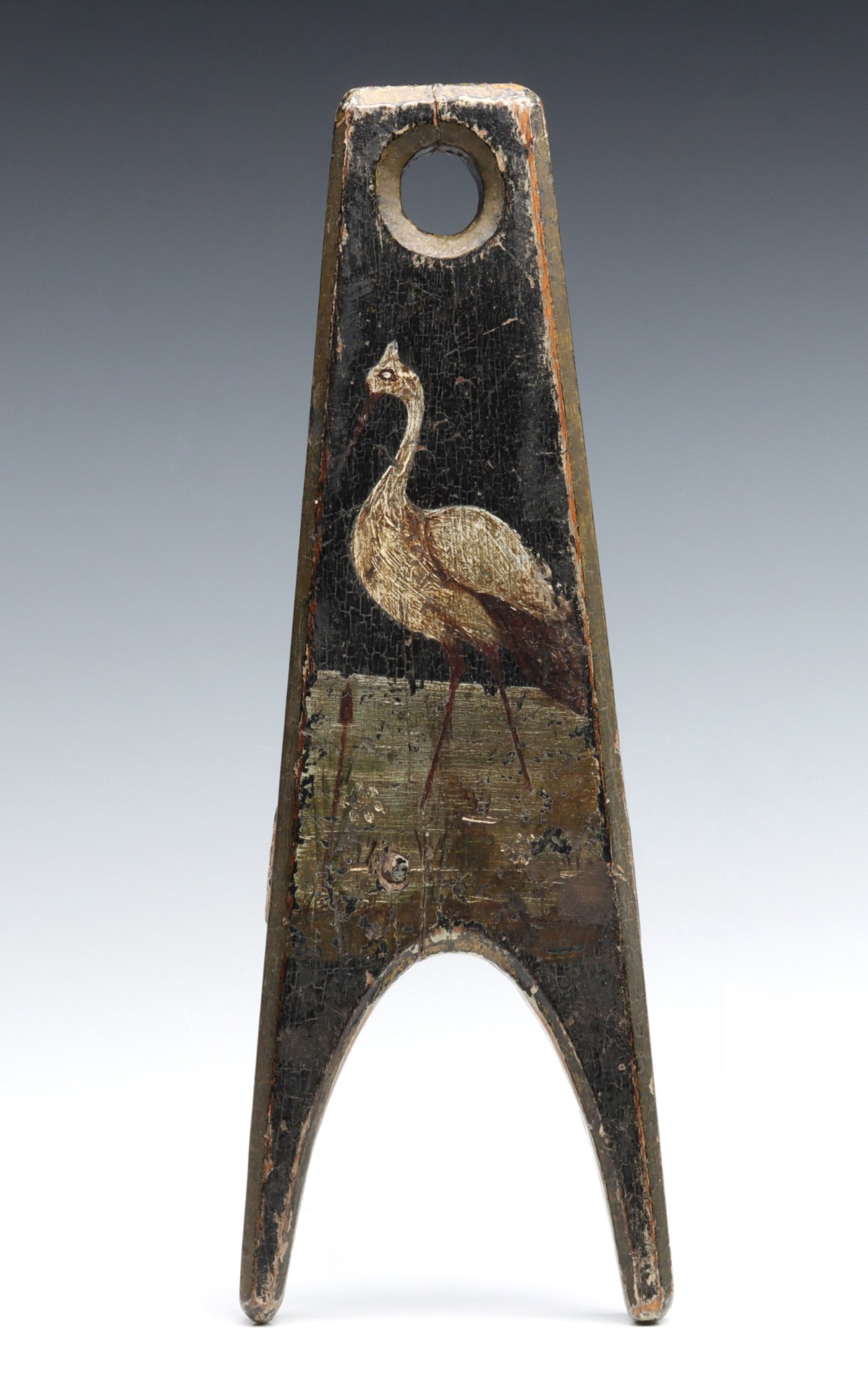 A CARVED AND PAINTED FOLK ART BOOT JACK DATED 1857
