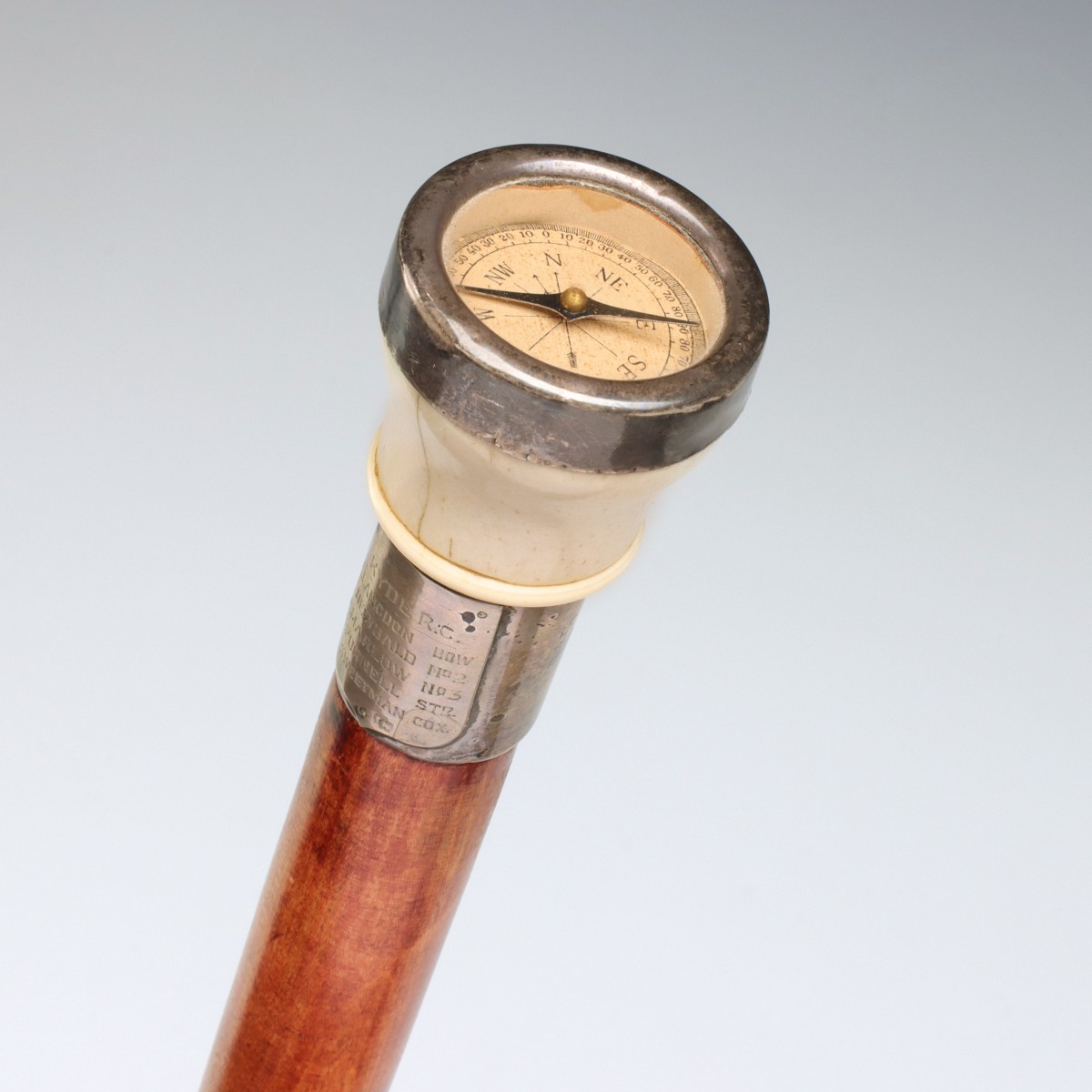 AN 1898 ROWING TEAM PRESENTATION CANE WITH COMPASS