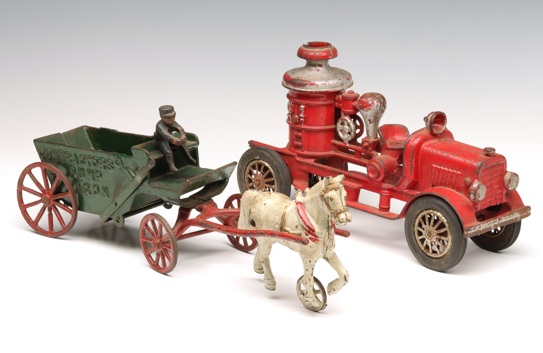 CAST IRON FIRE TRUCK AND HORSE DRAWN TOY