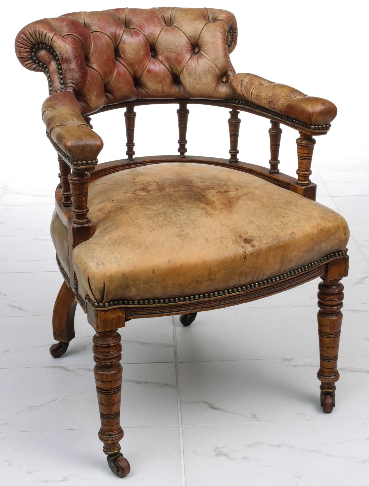 A 19C. ENGLISH BARREL BACK CHAIR IN ORIGINAL LEATHER