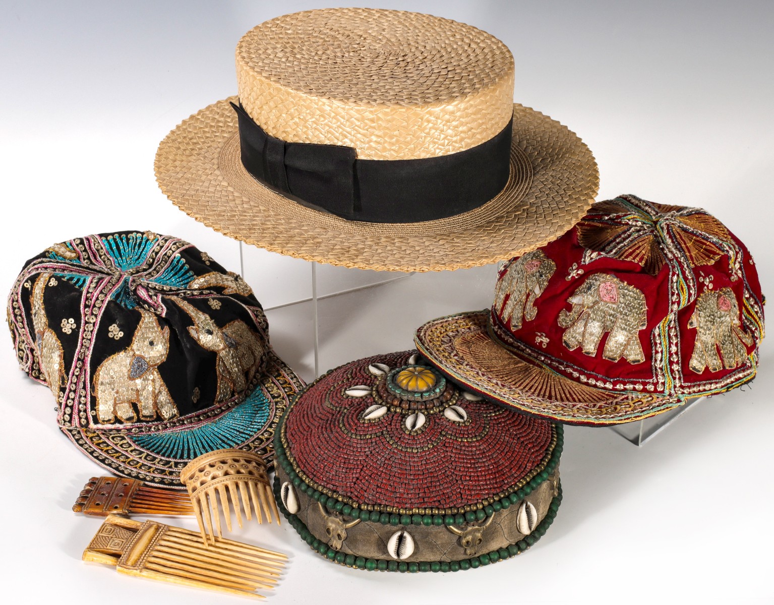 A COLLECTION OF HATS FROM VARIOUS CULTURES