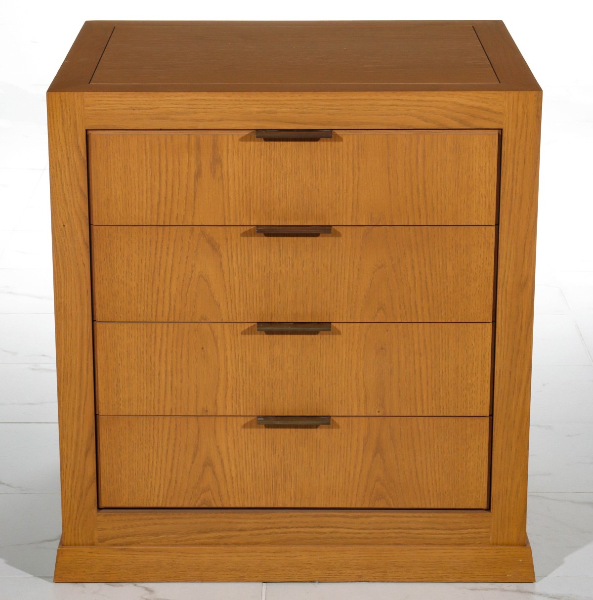 A 20TH C. OAK FOUR DRAWER CABINET WITH BRASS PULLS