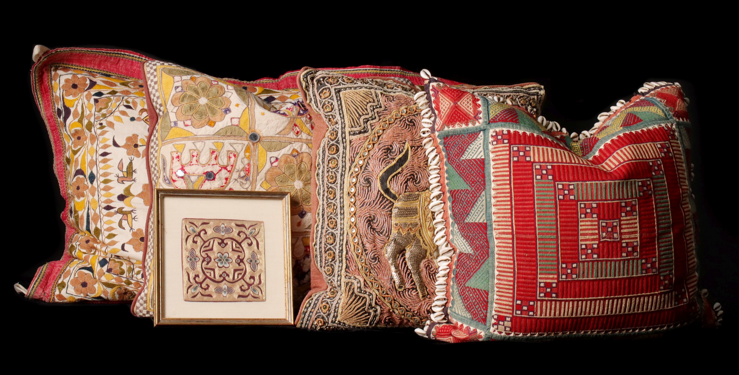 A COLLECTION OF LARGE EMBRODERED PILLOW COVERINGS