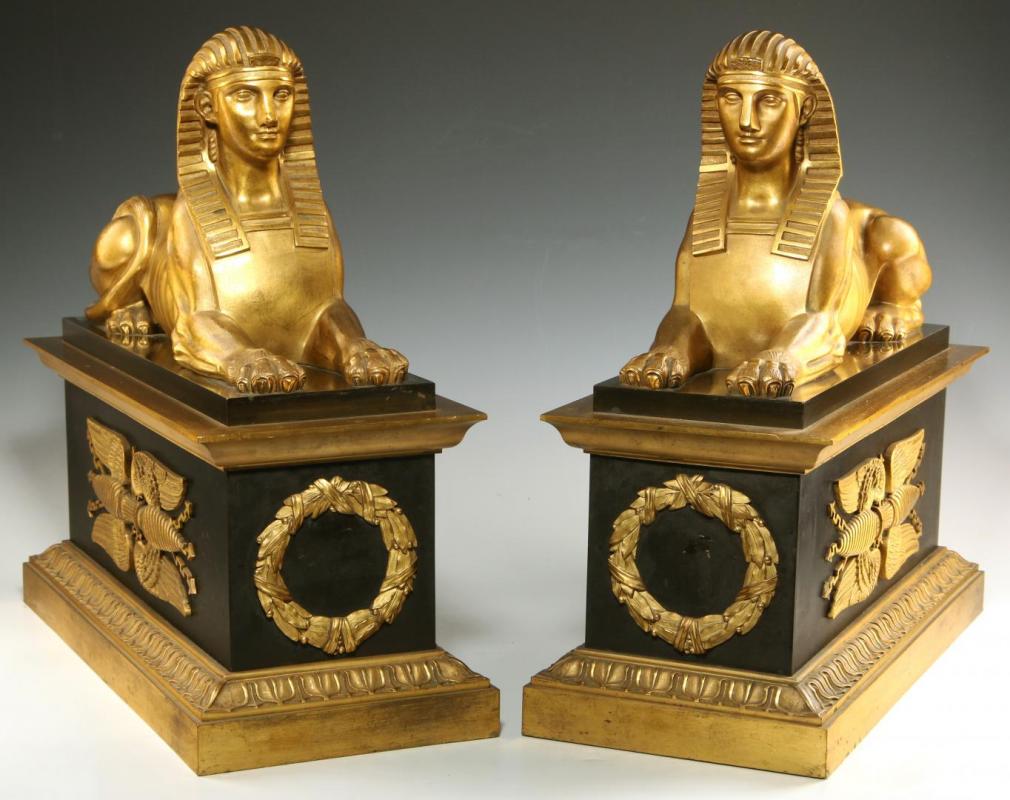 A PAIR GILT AND PATINATED BRONZE CHENETS WITH SPHINX 