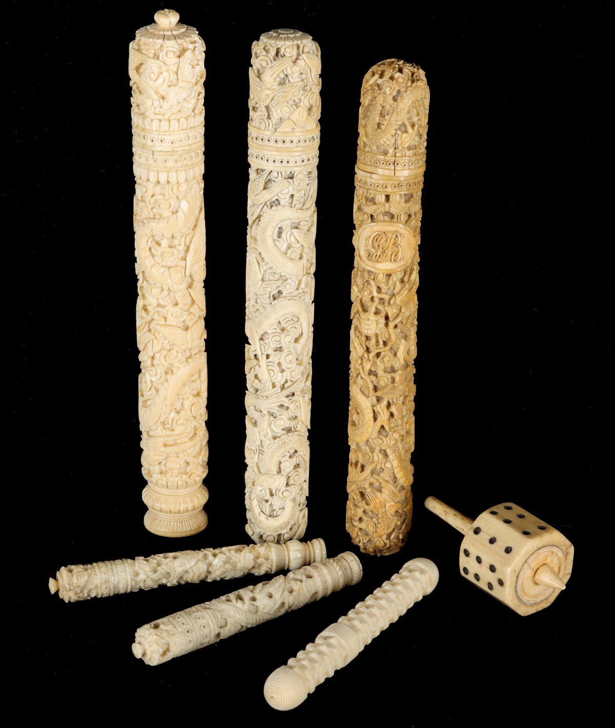 A COLLECTION OF ASIAN CARVED IVORY NEEDLE CASES