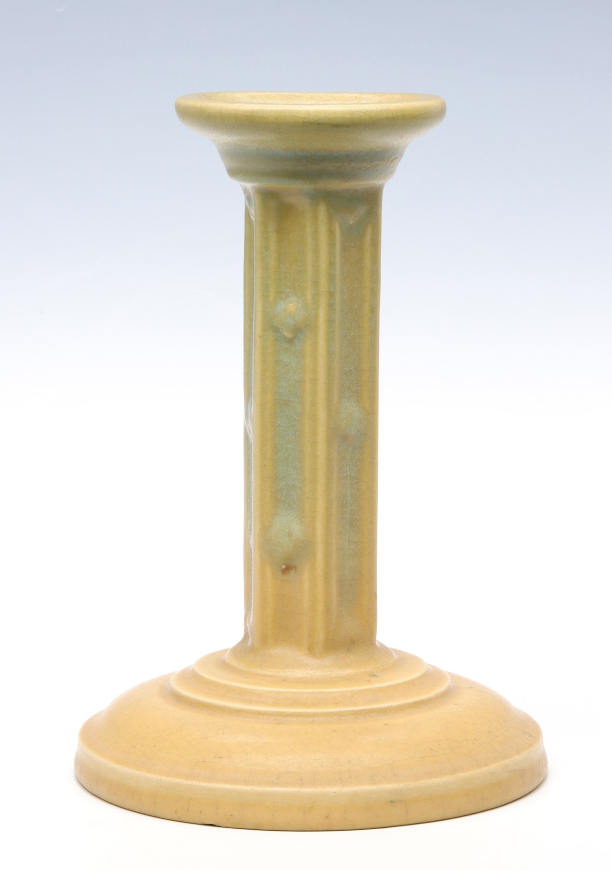 A ROOKWOOD ART POTTERY CANDLESTICK DATED 1915