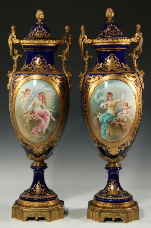 A GOOD PAIR OF 22-INCH SEVRES TYPE URNS SIGNED ROLLI 