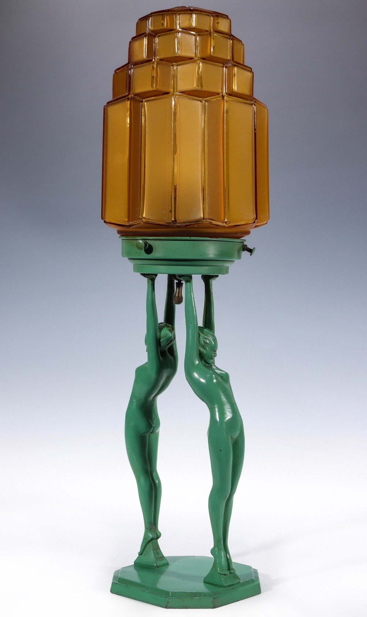 A FRANKART ART DECO LIGHT SUPPORTED BY NUDE FIGURES