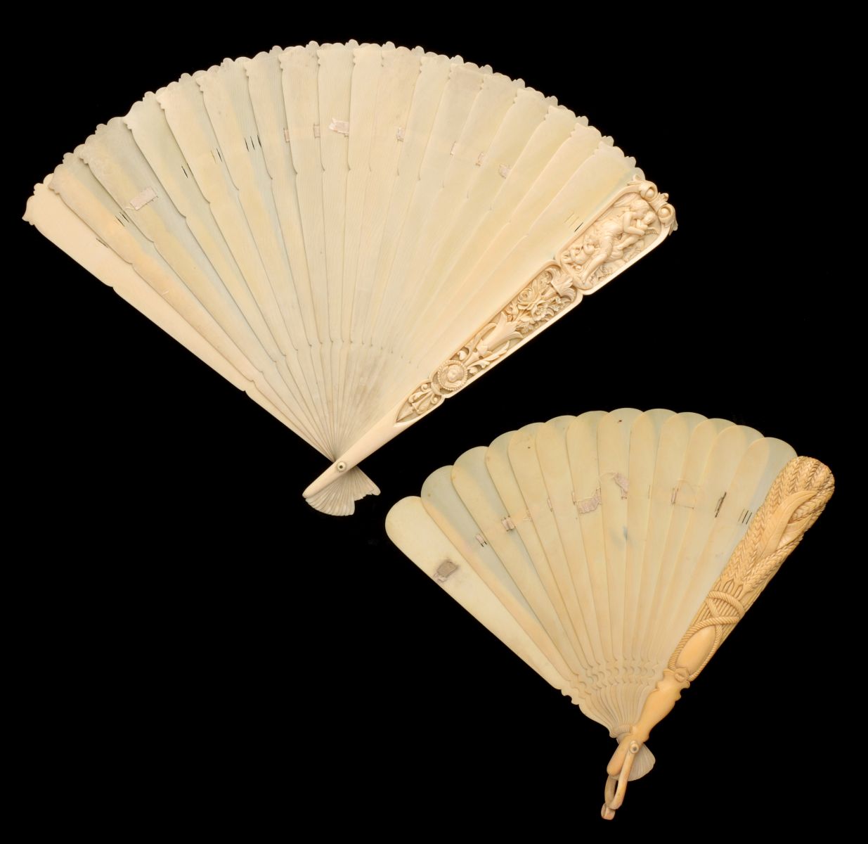 TWO 19TH C. IVORY HAND FANS WITH CARVING IN HIGH RELIEF
