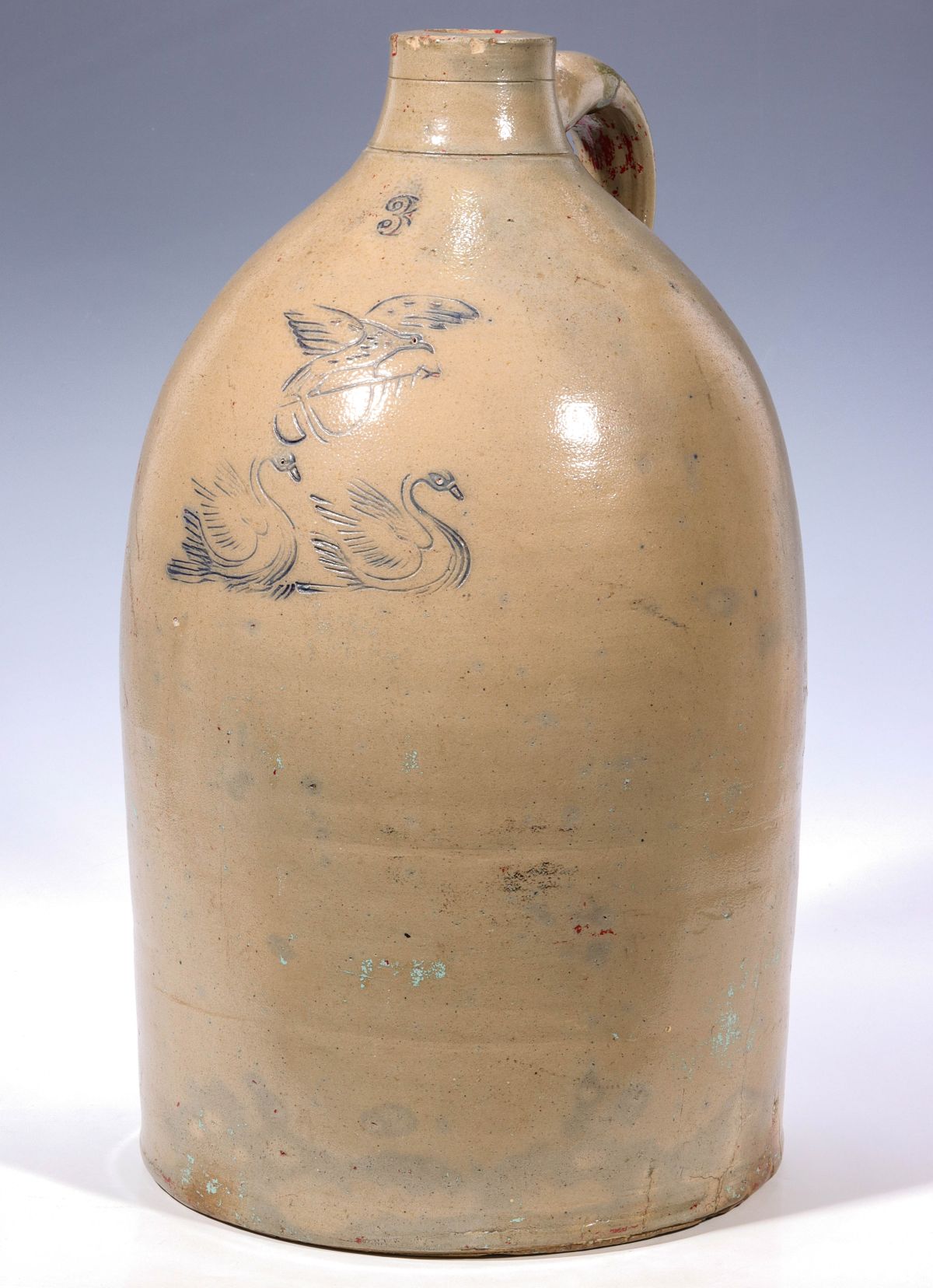 A BLUE DECORATED STONEWARE JUG WITH EAGLE AND SWANS