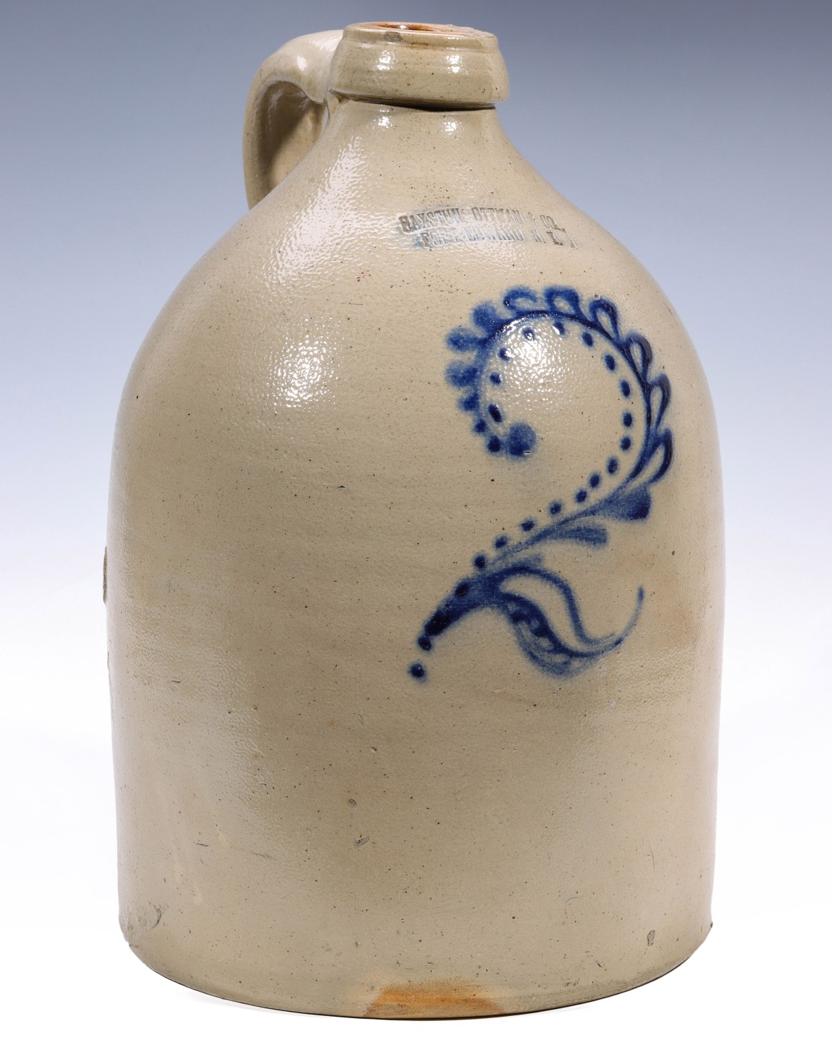 A BLUE DECORATED STONEWARE JUG STAMPED HAXSTUN