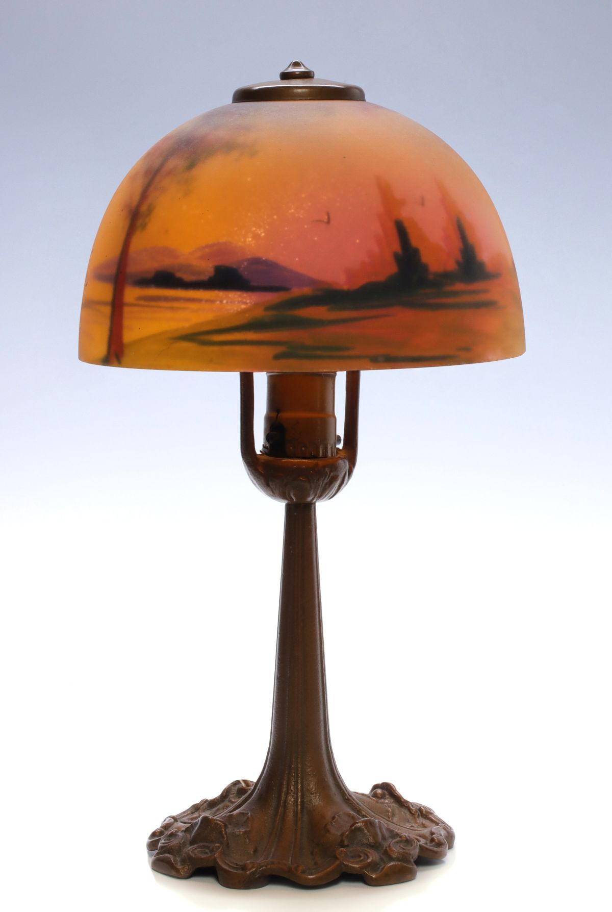 A REVERSE PAINTED BOUDOIR LAMP SIGNED ALADDIN