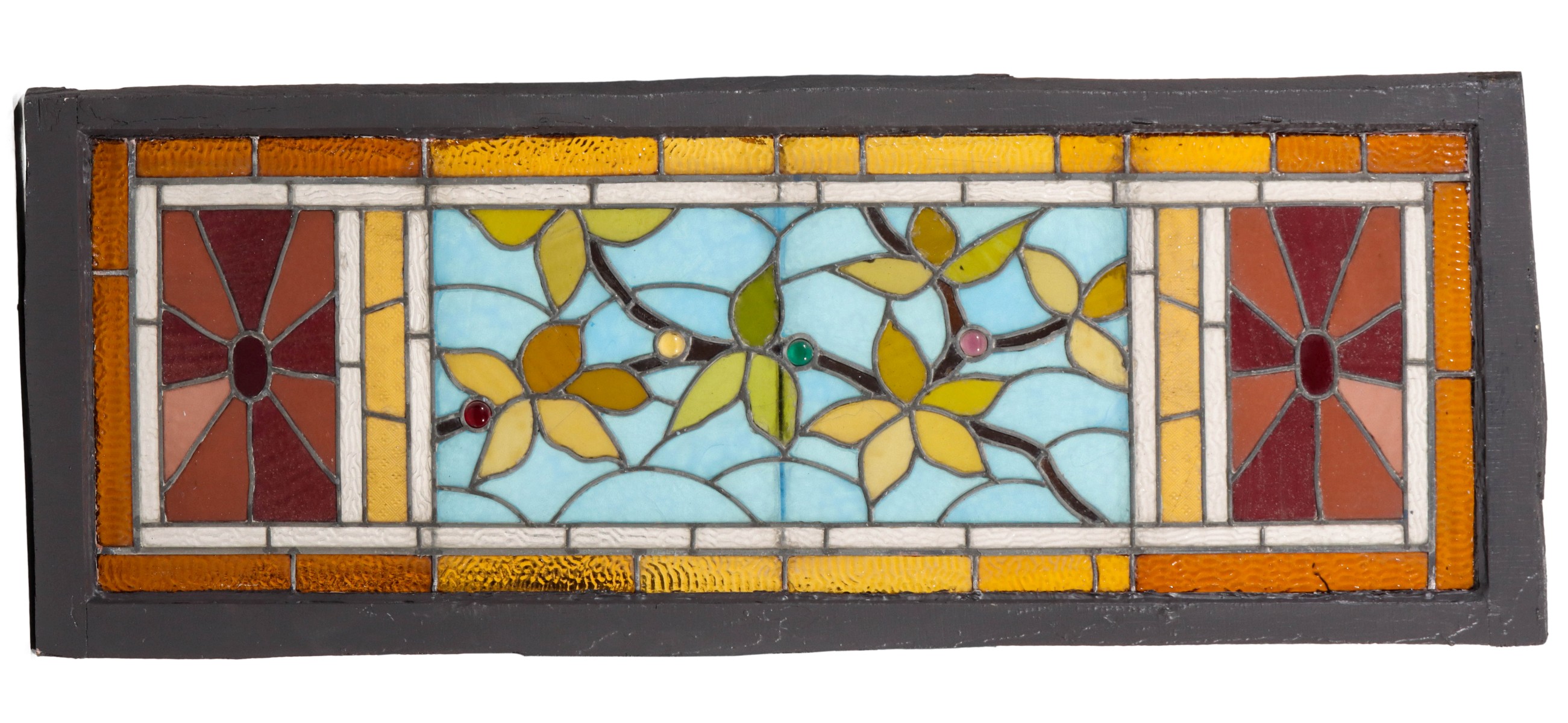 A 12-COLOR STAINED AND LEADED GLASS WINDOW WITH JEWELS