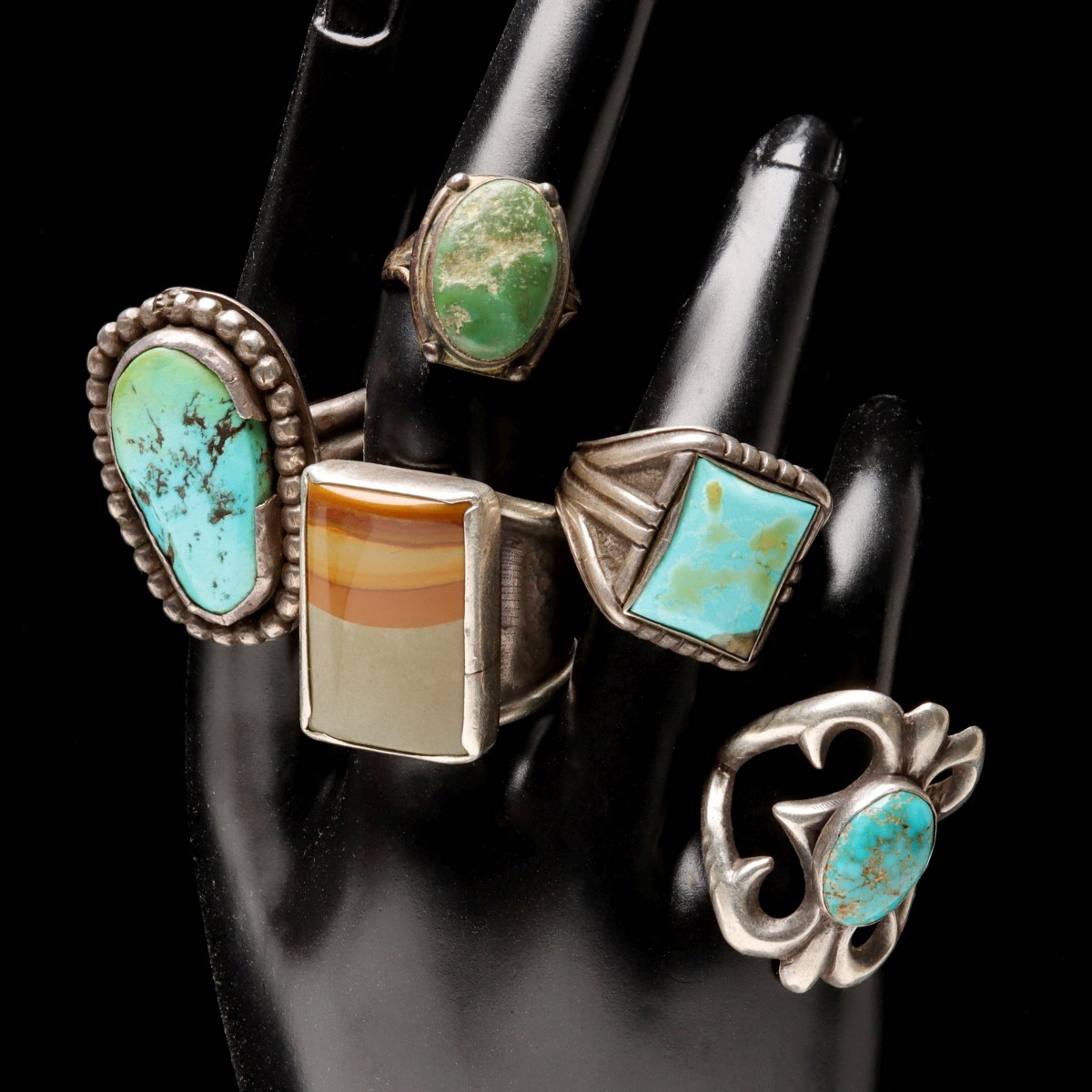 A COLLECTION OF SAND CAST AND OTHER NAVAJO JEWELRY
