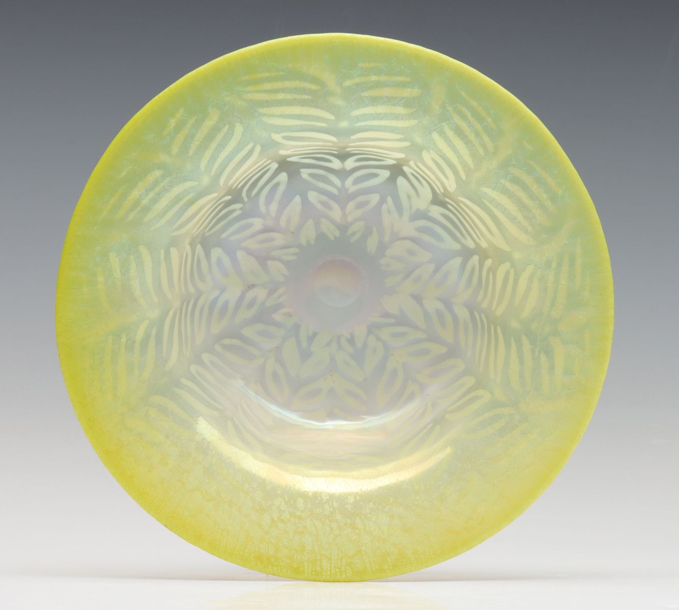 A YELLOW PASTEL GLASS BOWL SIGNED L.C. TIFFANY